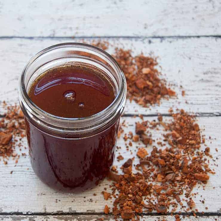 A pint mason jar filled with tonic syrup