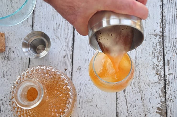 Pouring Tonic Water into the Cocktail Glass