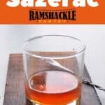 A simple Sazerac cocktail on a wood platter and the text "Classic Cocktails Sazerac" text right above it