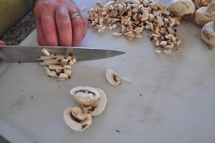 Chopping mushrooms for cream of mushroom soup.