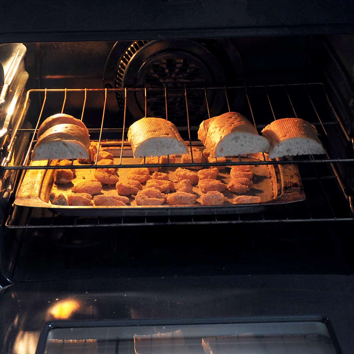 shrimp and french bread in oven baking