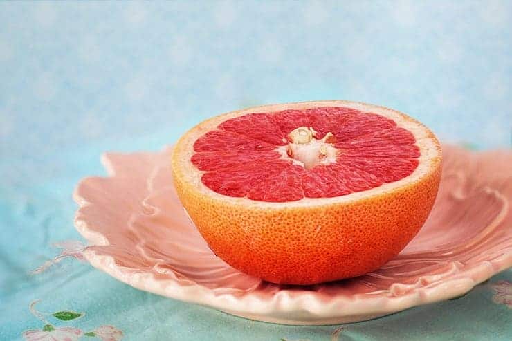 Half of a grapefruit on a plate