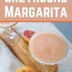 "Frozen Greyhound Margarita" with a picture of a frozen drink on a cutting board. There are two grapefruits in the picture