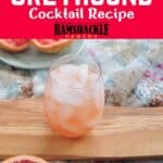 "Classic Greyhound Cocktail Recipe" with a drink sitting on a cutting board and a floral cloth underneath that.