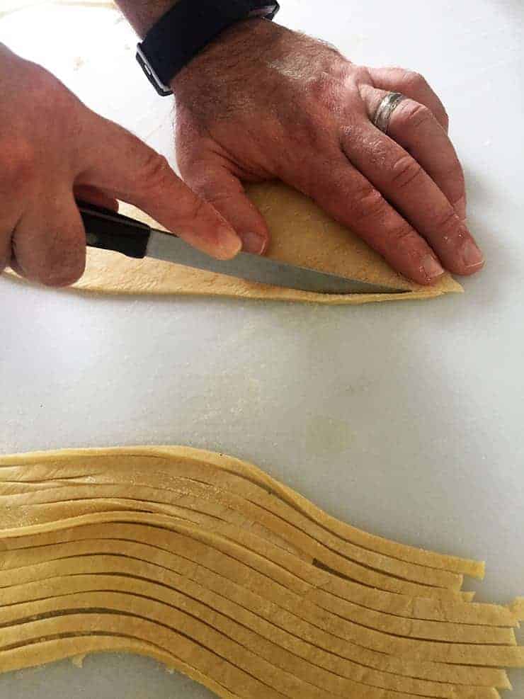 Cutting noodles individually.