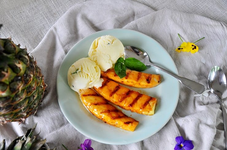 completed sriracha honey grilled pineapple with a basil ice cream