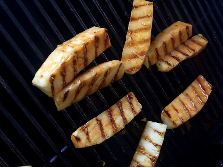 Grilling pineapple with good grill marks on one side