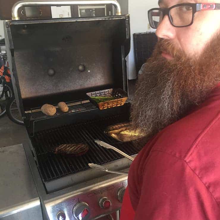 Me Looking back as I am searing my ribeye. Just grilling steak.