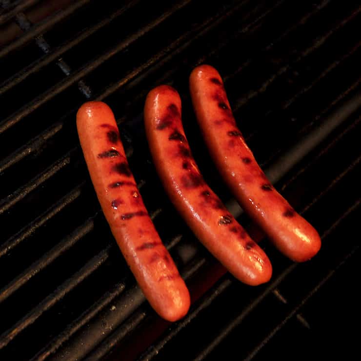 Three Ambassador Weiners on my Weber Grill