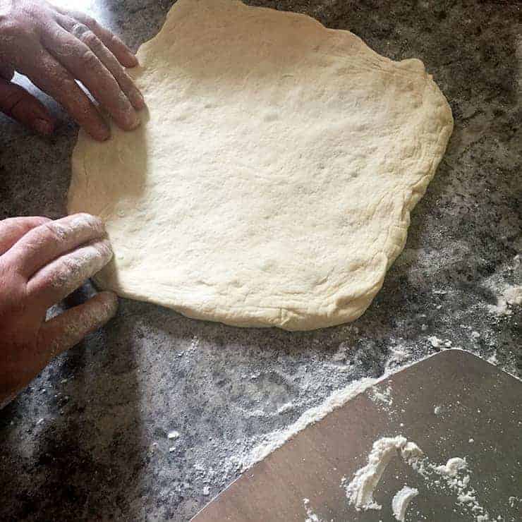 Pizza Dough mid stretch.