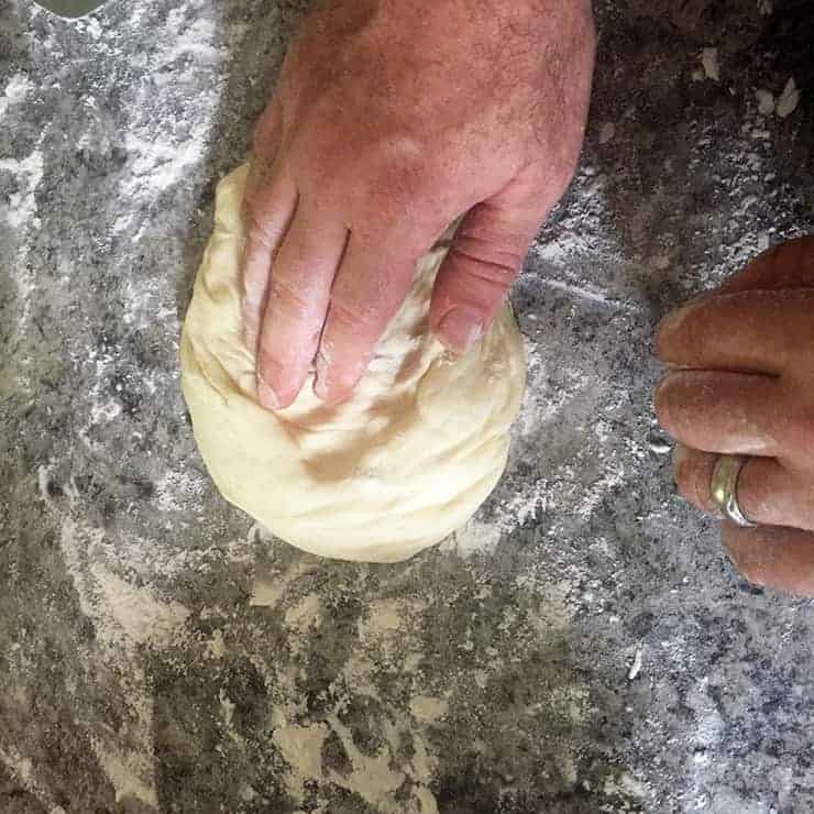 Pizza dough after risen and placed on spot to stretch.