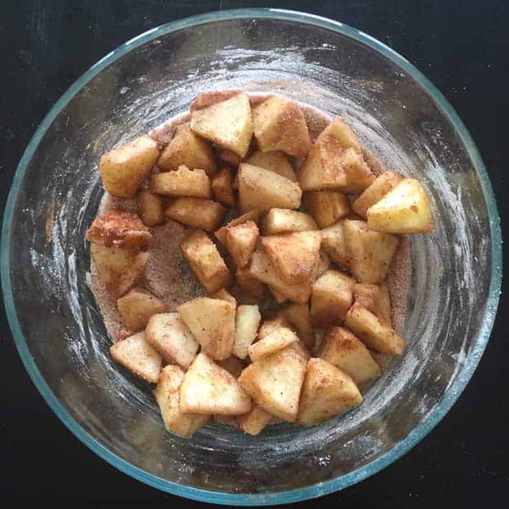 Apples mixed for apple hand pies recipe.