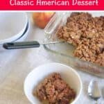 Apple Crisp - Classic American Dessert on a white tablecloth.