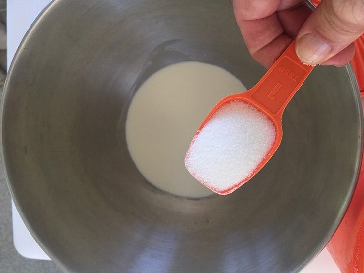 Pouring sugar into the cream right before it gets whipped.