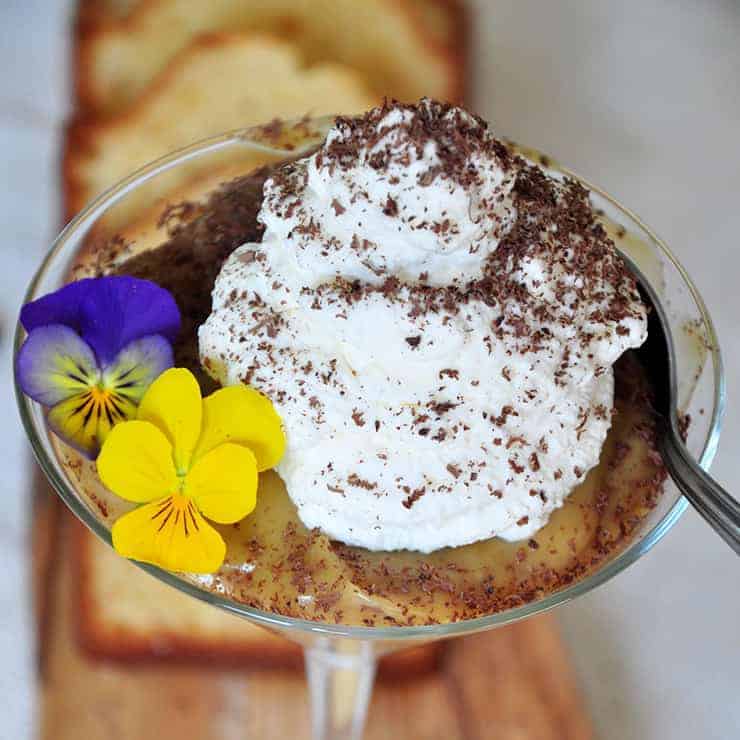 Close up of the Kahlua dessert in a cocktail glass and a spoon dipping into this yummy dessert!