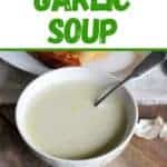 Julia Child's Garlic Soup with a picture of the soup in a white bowl.