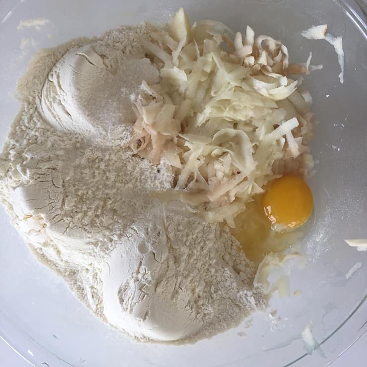 All of the dumpling dough ingredients in a glass bowl before they were mixed.