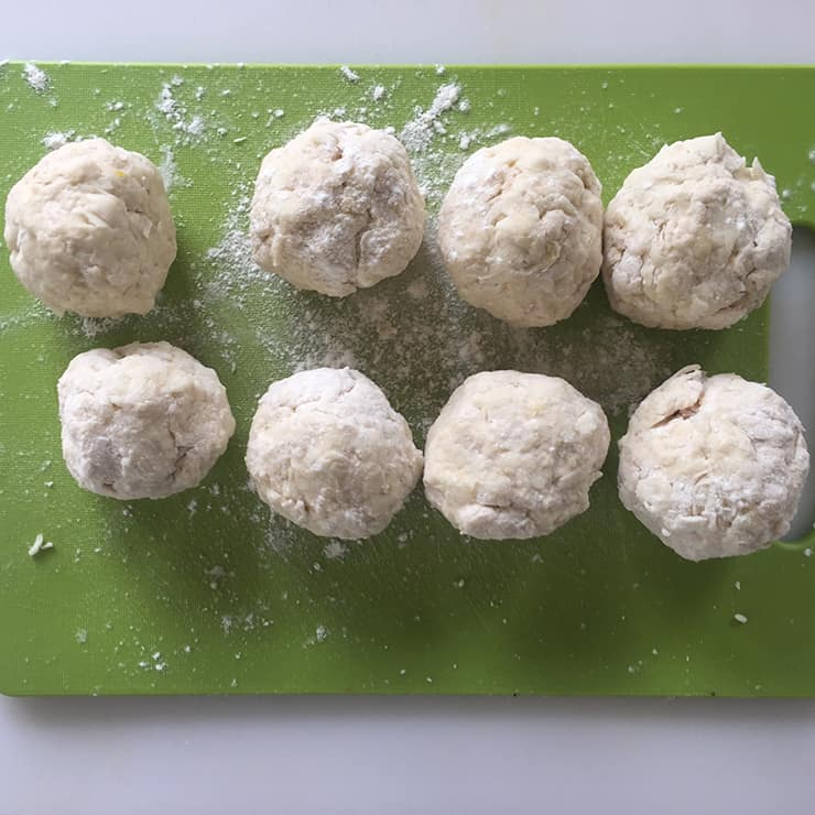 Formed klubb dumplings before they are put into simmering water