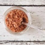 An overhead shot of bacon salt in a half pint jar