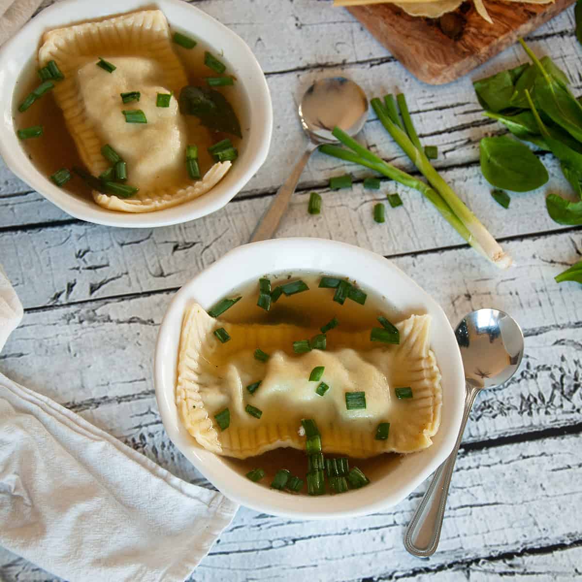 Maultaschen in two bowls of soup.