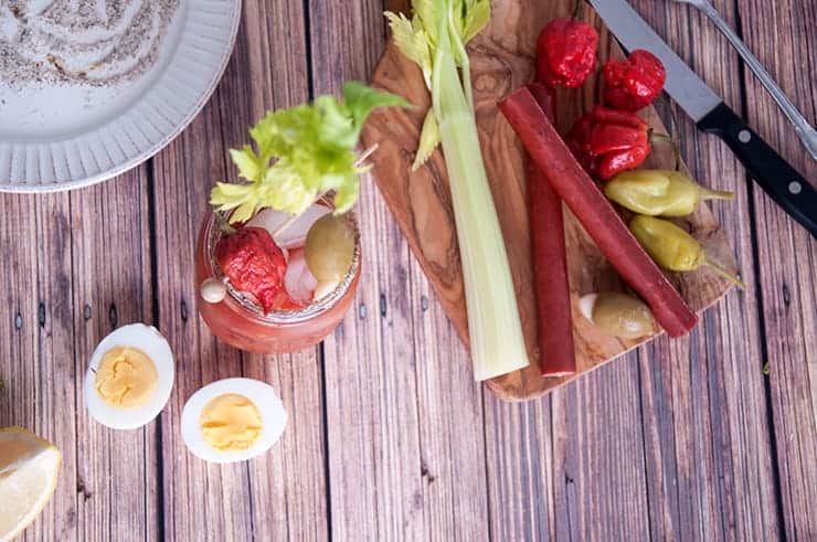 The Super Spicy Bloody Mary and sides all on a picnic table