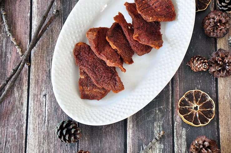 Overhead Beef Jerky on a white plate. 