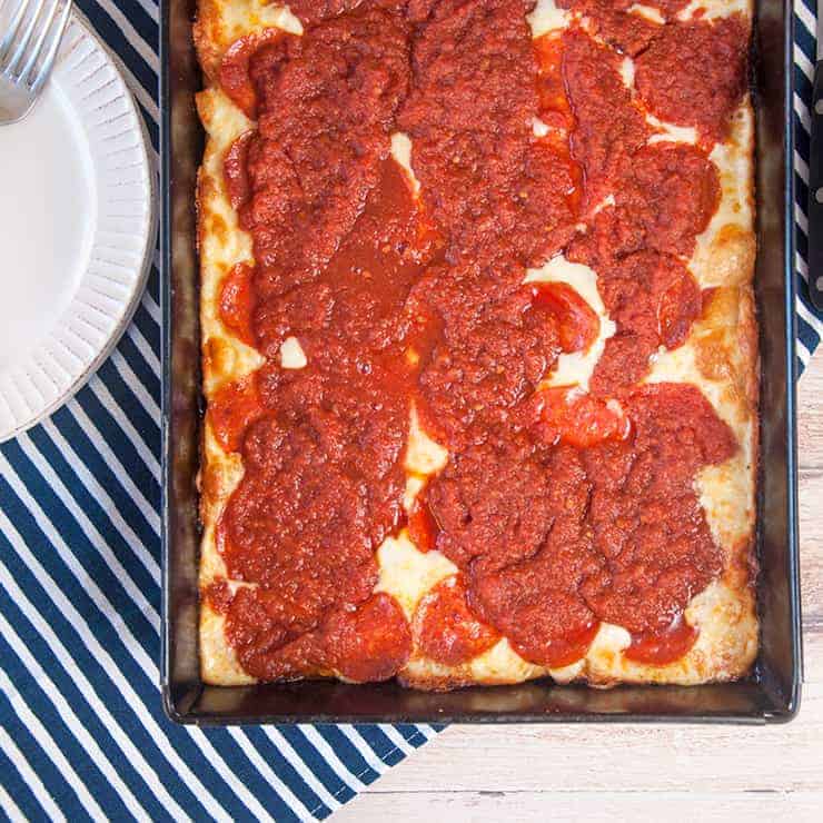 Overhead picture of a full pan of Detroit Style Pizza.