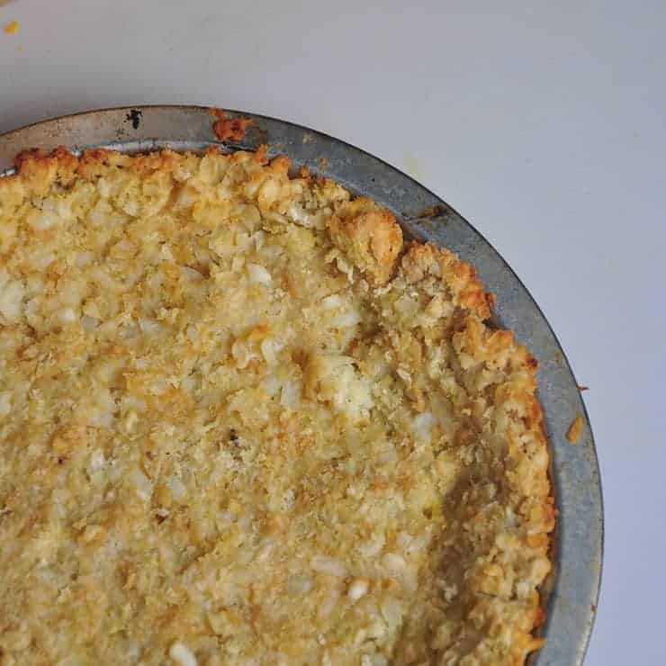 Baked Tater Tot Pie Crust before Meat Mixture has been put in pie tin.