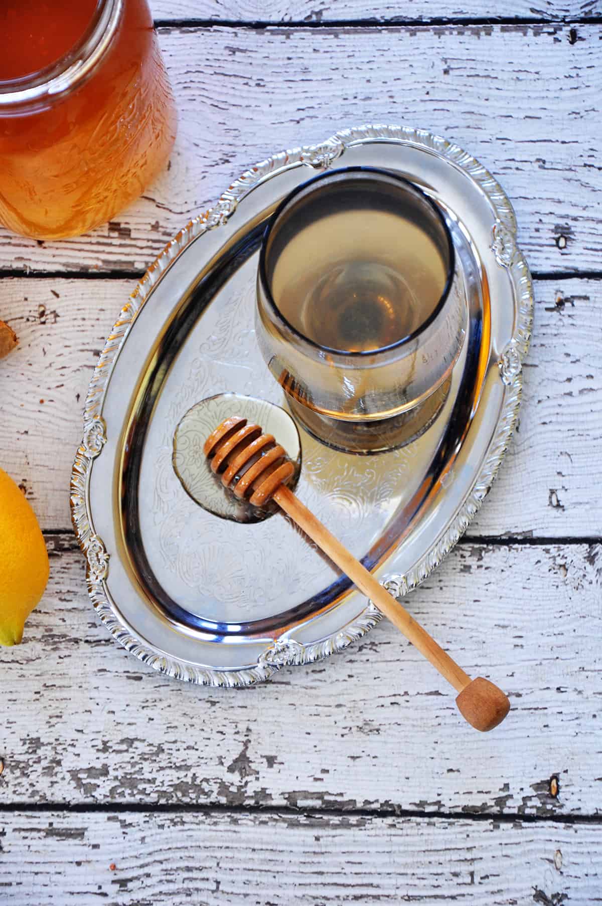 Overhead picture of Homemade Honey Ginger Tea on a silver platter