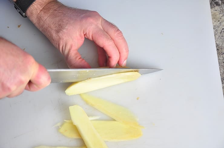 Slicing Ginger on a Cutting Board