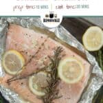 Grilled Foil Packet Salmon on tinfoil and a baking sheet with some asparagus to the side.