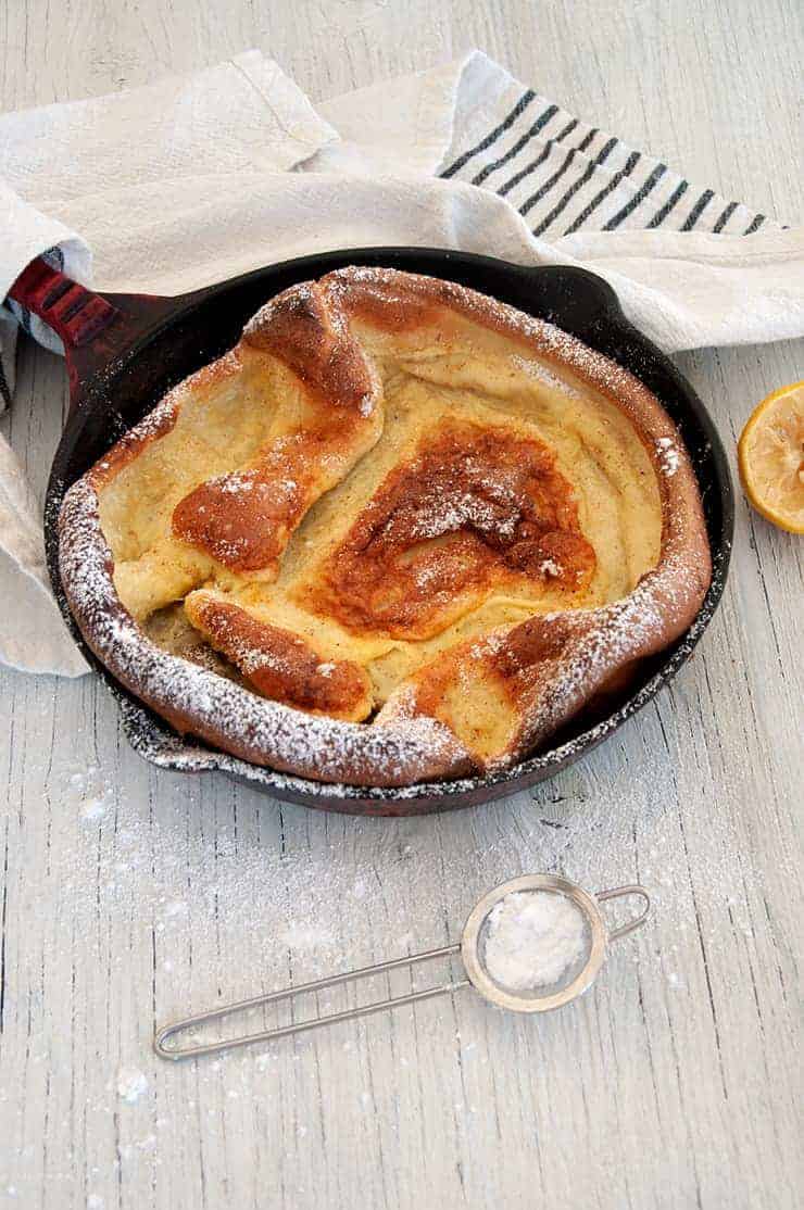 Side view of the dutch baby on a white table.