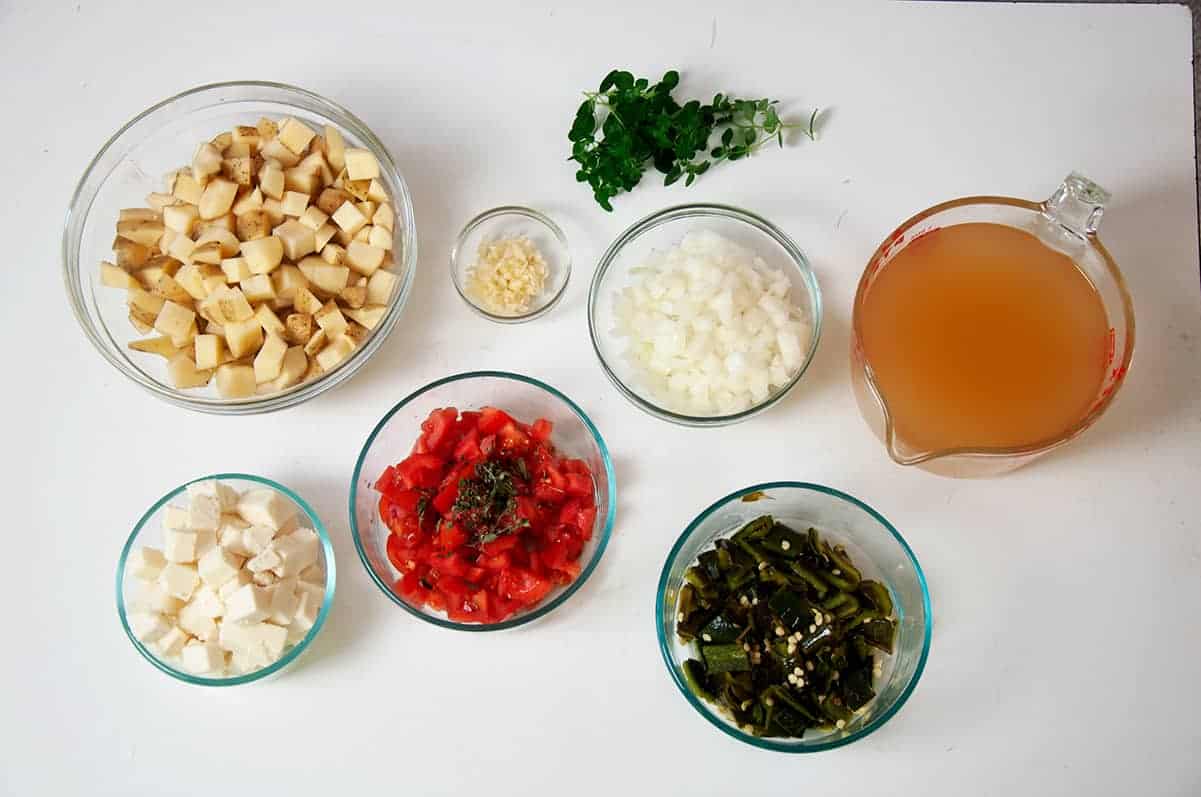 Many of the Ingredients for this soup including Queso Fresco, tomato, oregano, roasted poblano peppers, and chicken broth.