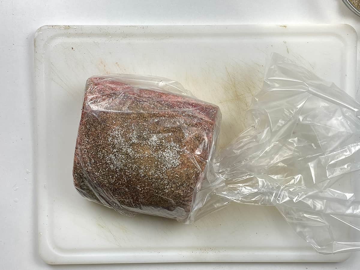 A prime rib in a bag just prior to be added to the sous vide.
