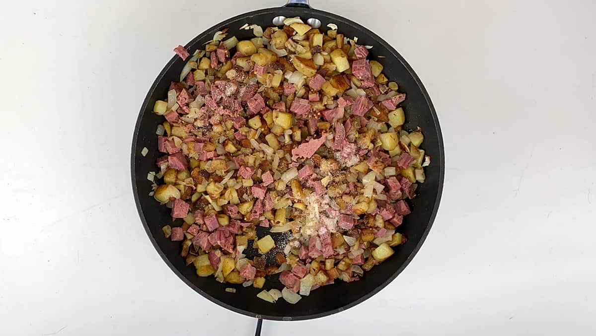 Skillet with almost completed corned beef hash.