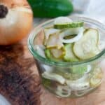 Refrigerator Pickles in a small bowl with cucumbers and onions.