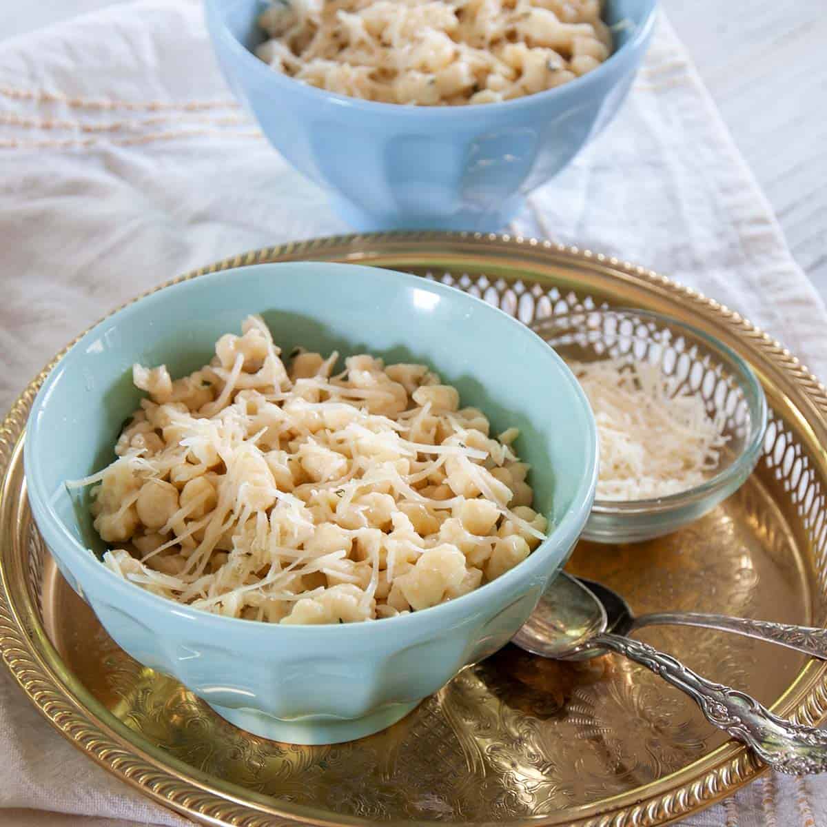 Bowl of Spaetzle with parmesan cheese on top.
