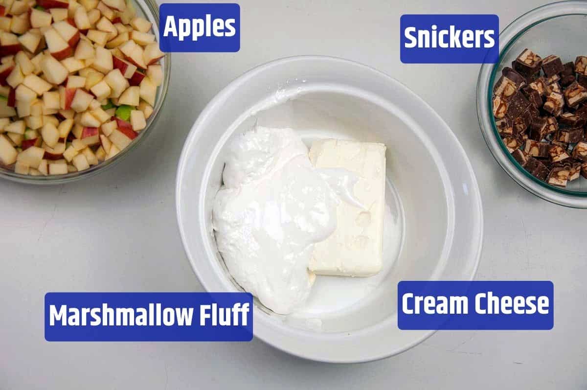 One dish that contains the marshmallow puff and cream cheese, but two others that contain the apples and Snickers.