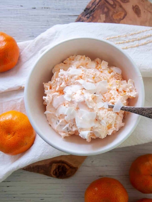 Mandarin orange salad in a white bowl.