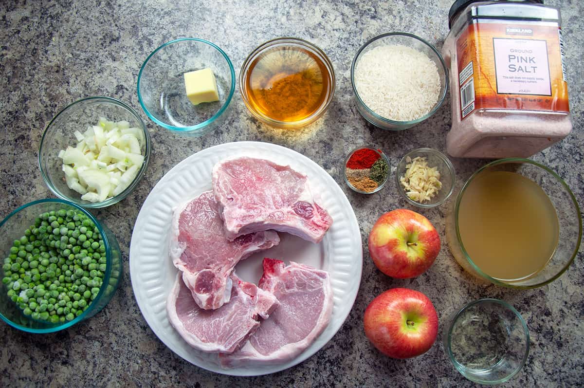 Ingredients for baked pork chops with rice and apples.