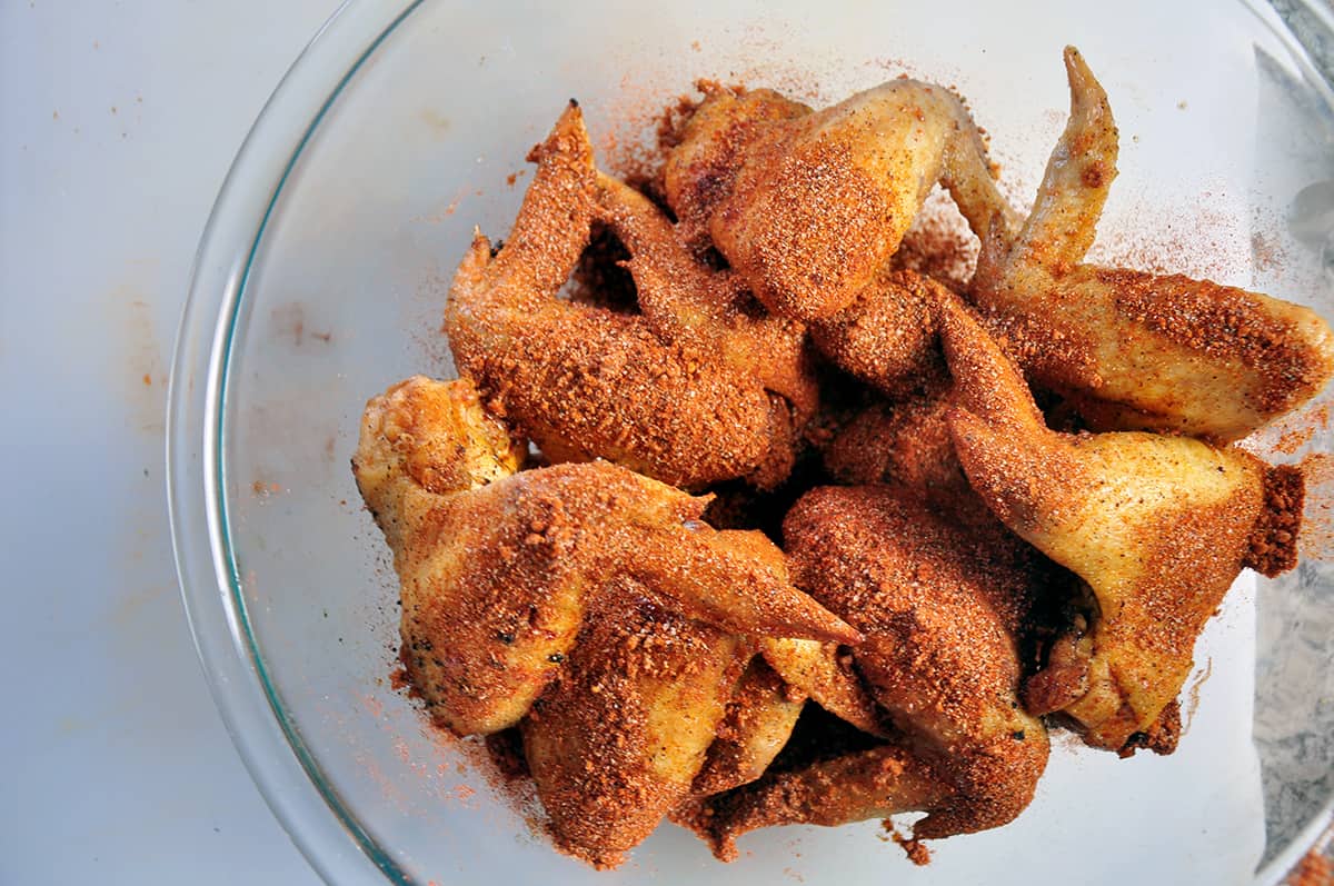 Fried wings with dry rub sprinkled on top.