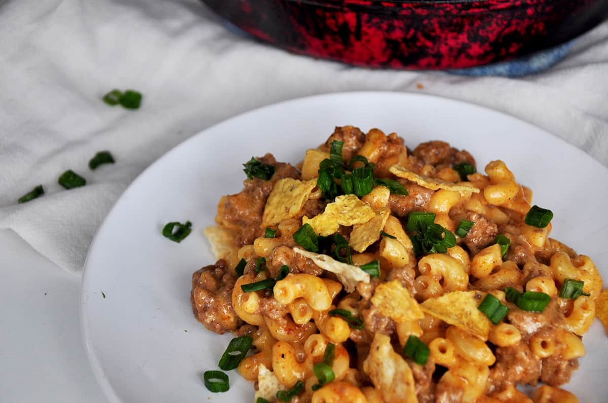 A serving of Beefy Taco Mac and Cheese on a white plate.