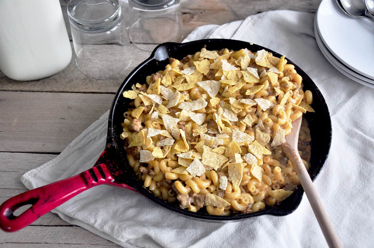 Beefy Taco Mac and Cheese in a red cast iron skillet.