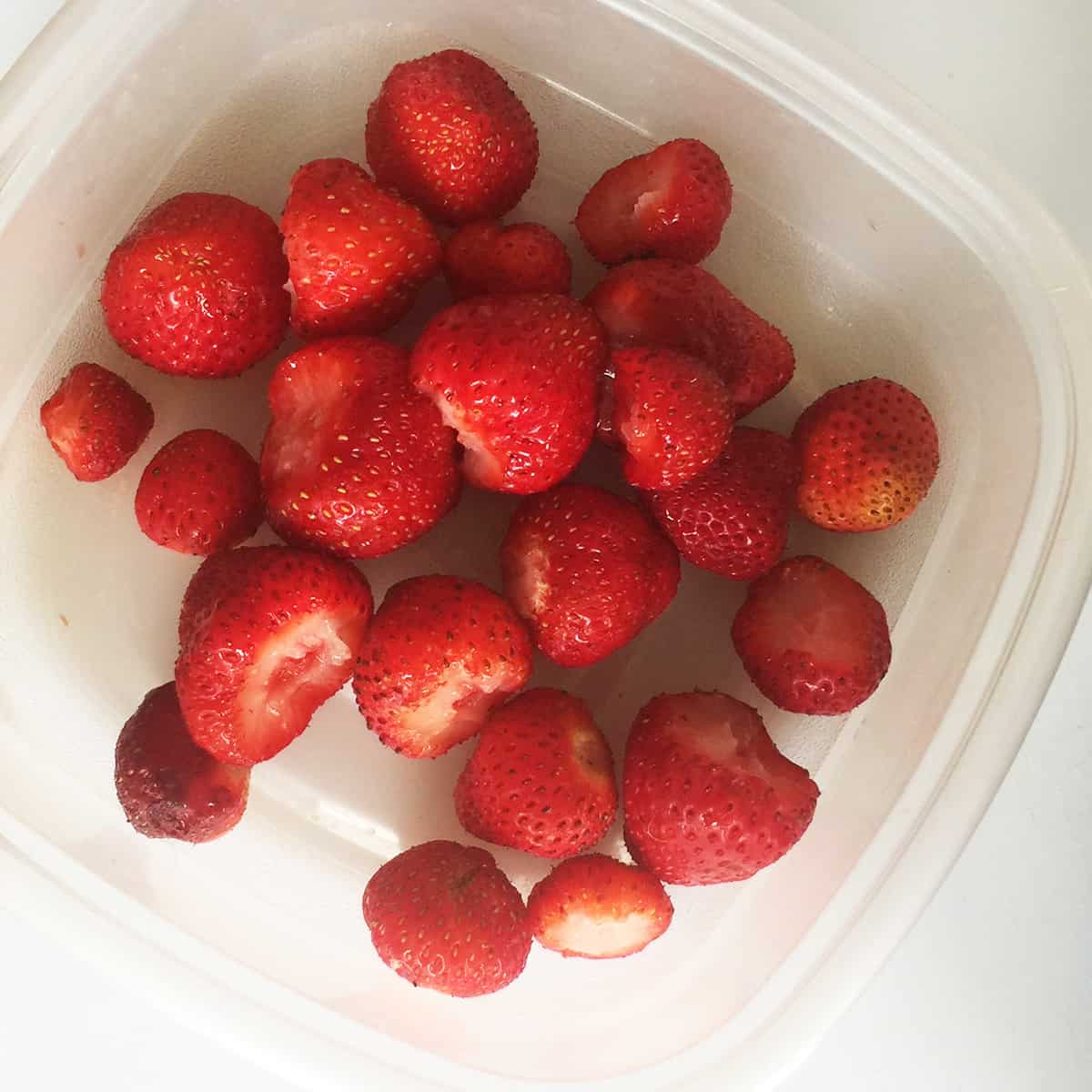A container of fresh strawberries.