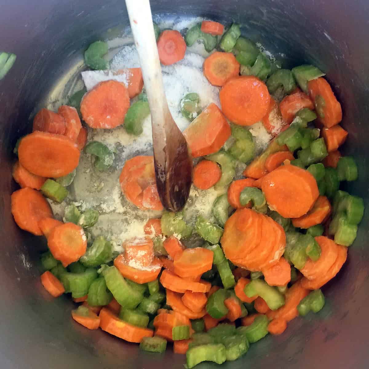 Carrots and celery in a pot.