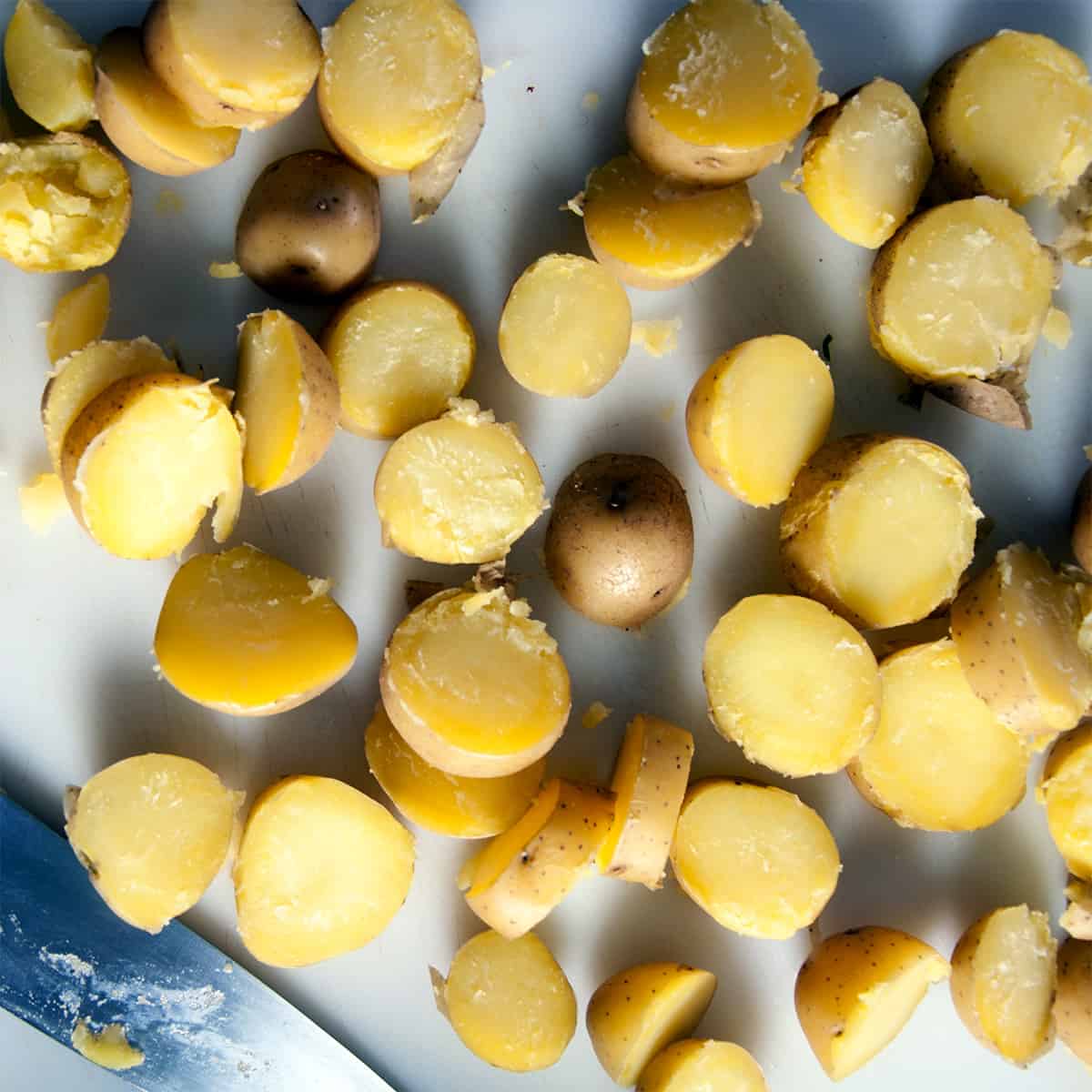 Yukon potatoes on a cutting board.