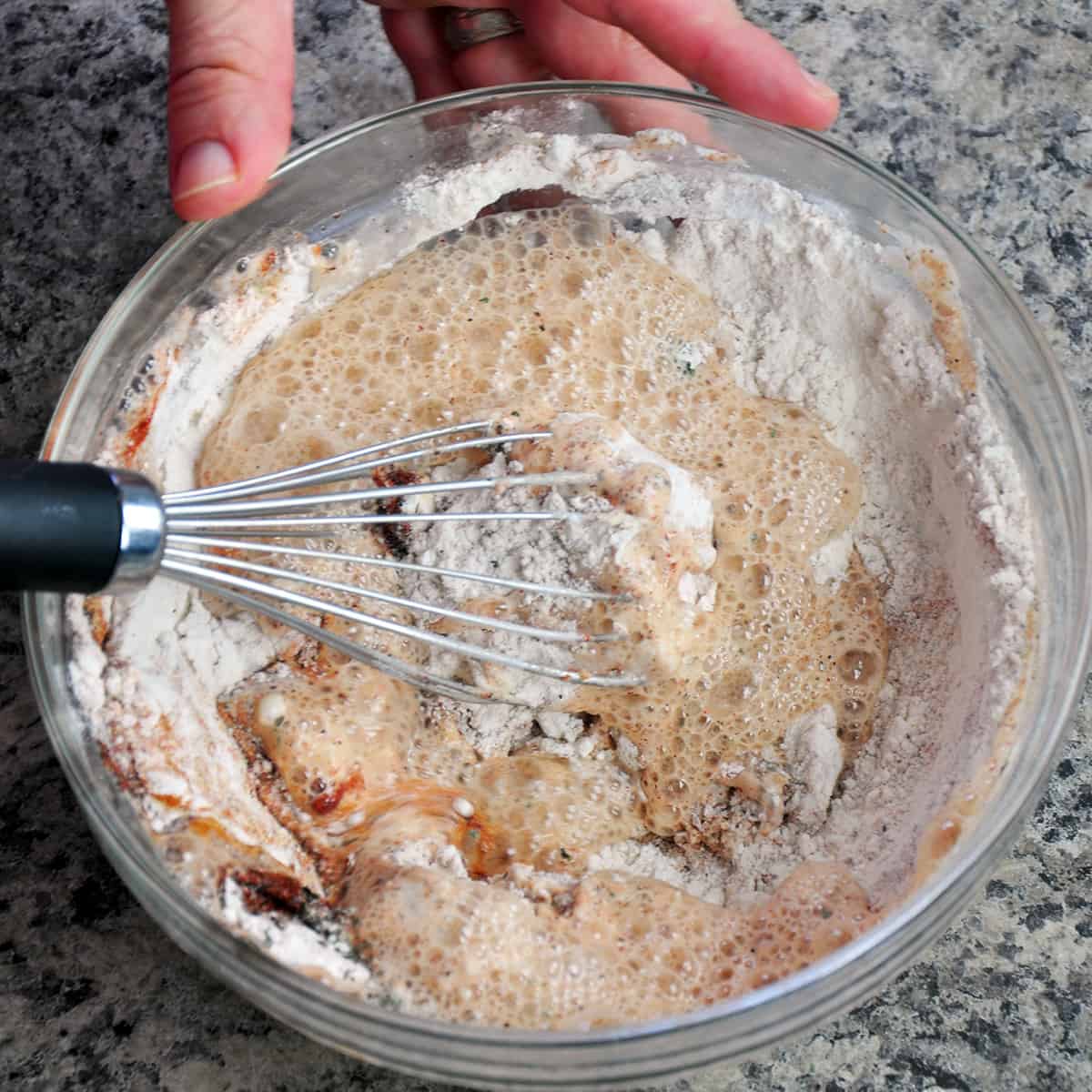 Whisking beer into your flour mixture.