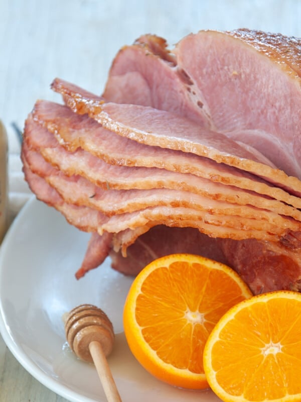 Sliced ham on a white plate.