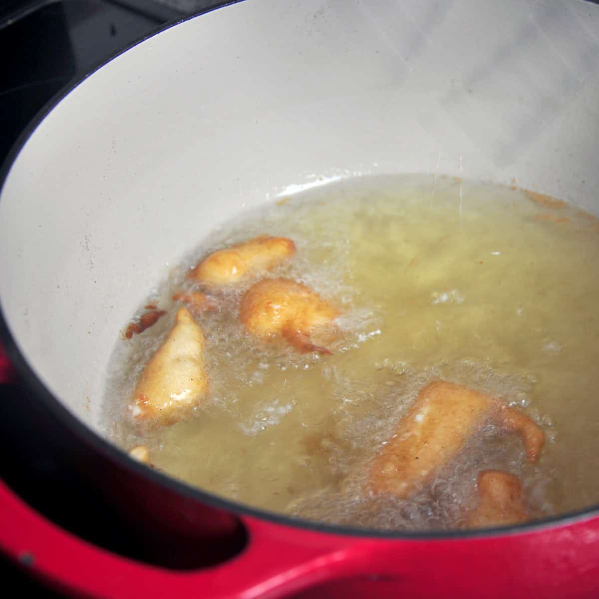 Cheese curds frying in Dutch oven.