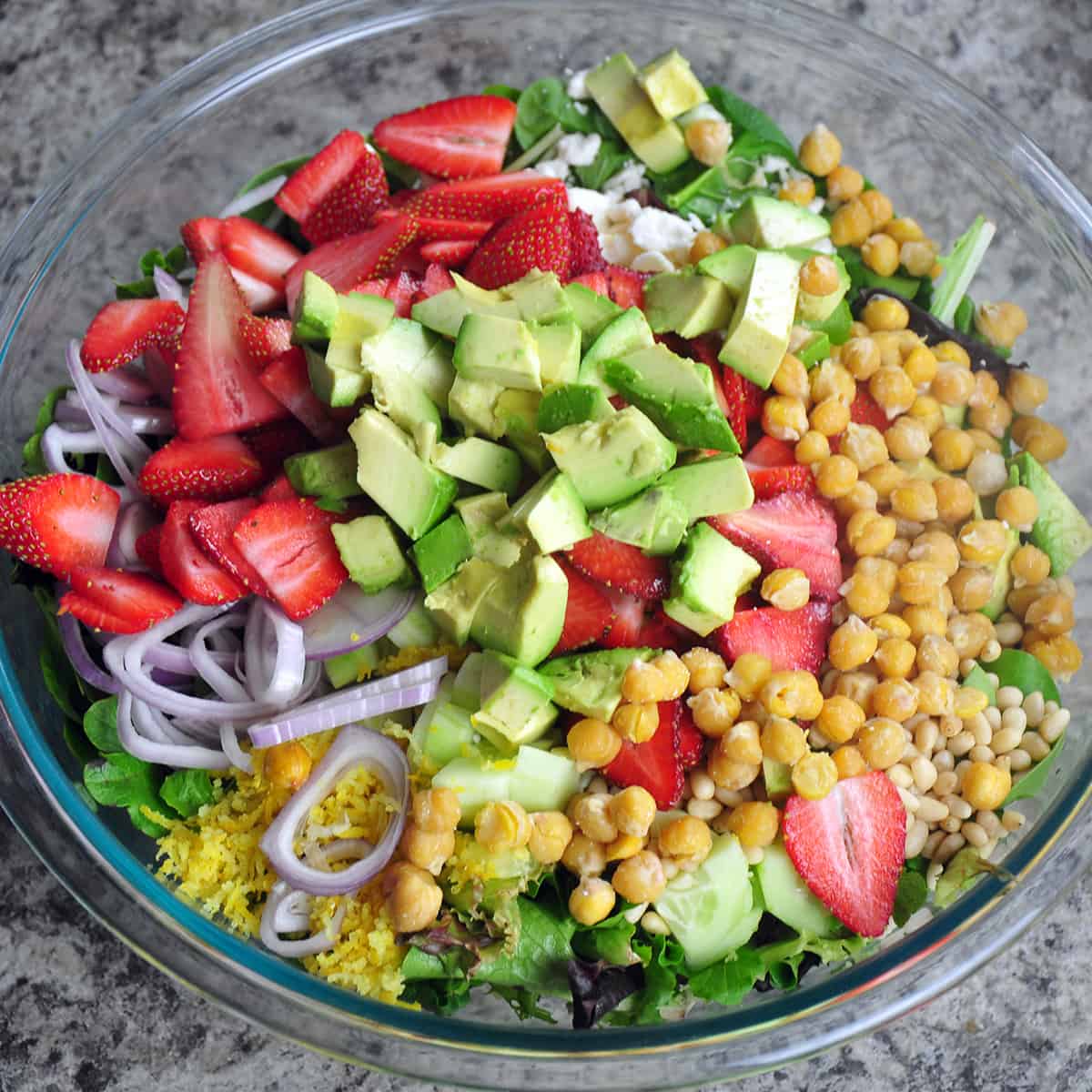 Colorful bowl of lettuce and salad ingredients.